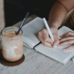 Creating Boundaries as a Freelancer Without Feeling Guilty Person writing on white paper