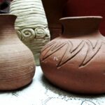 A Beginner-Friendly Guide to Hand-Painting Terracotta Pots Α group of three vases sitting on top of a table
